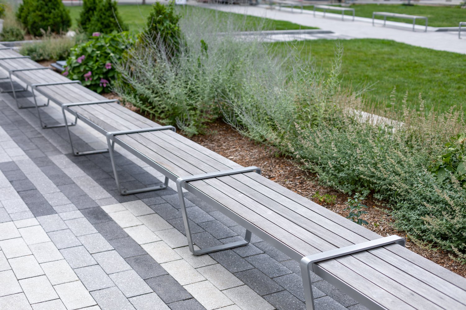 office building patio with pavers and bench