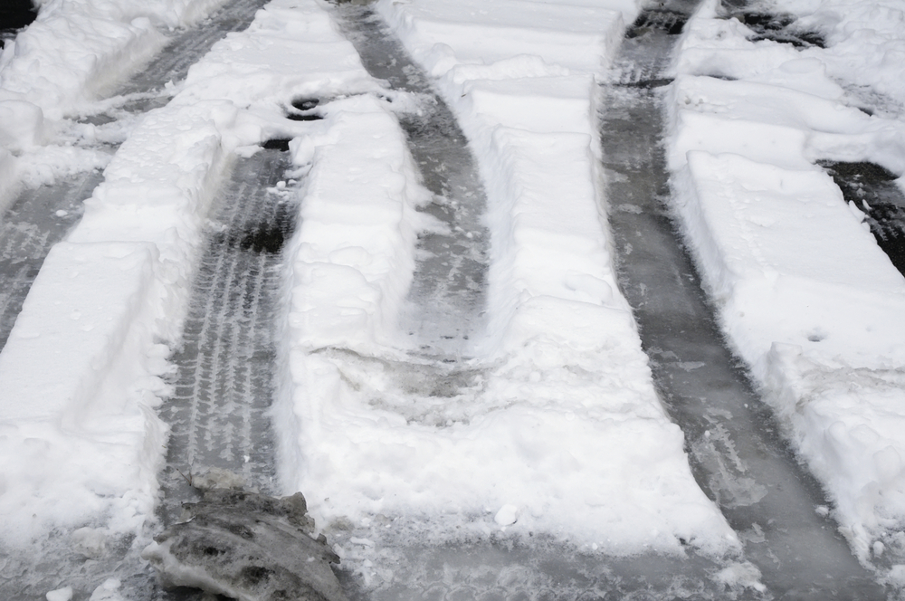 snow tracks in parking lot of hospital