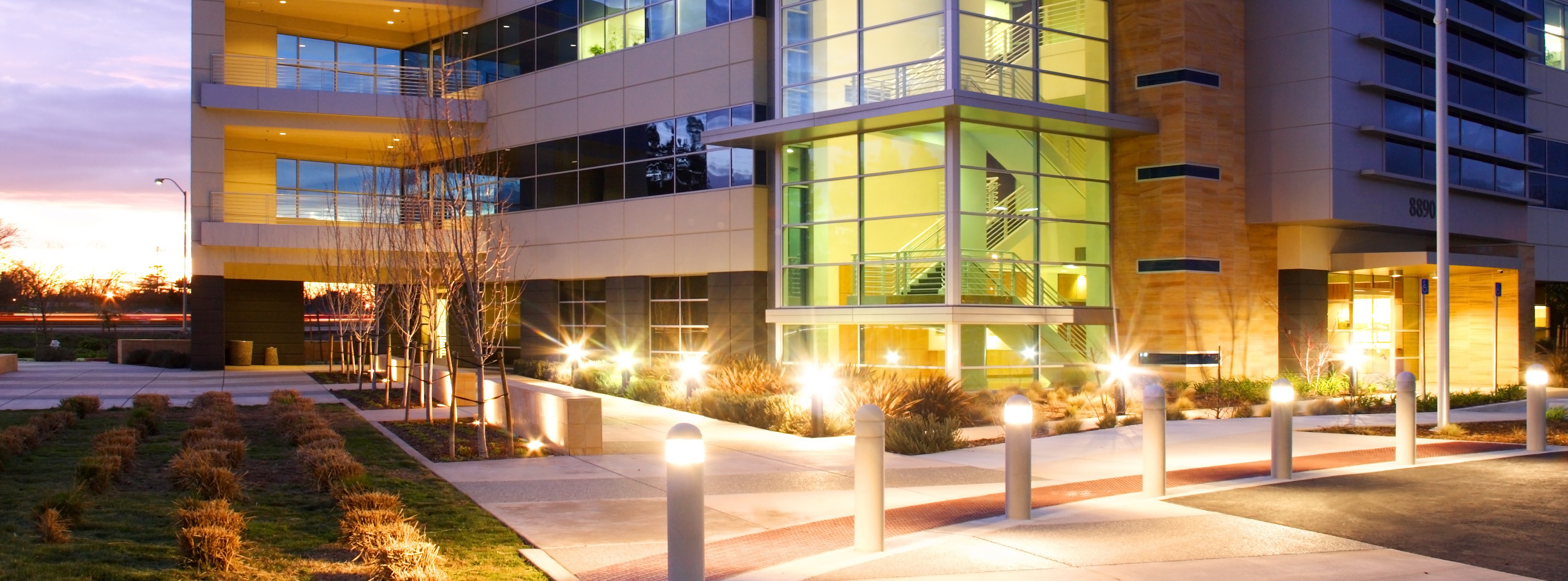 building with commercial landscape lighting