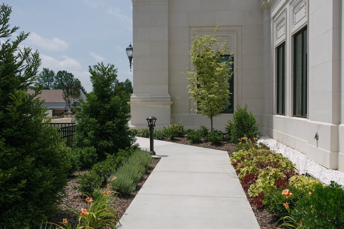 plant beds with mulch along walkway