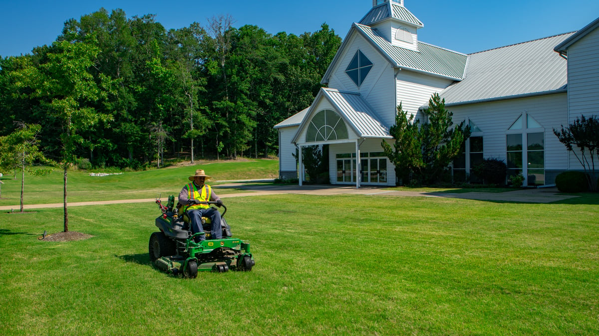 Commercial landscaping Church crew mowing 