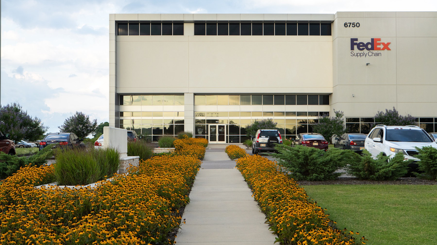 FedEx Warehouse with perennial plantings along sidewalk