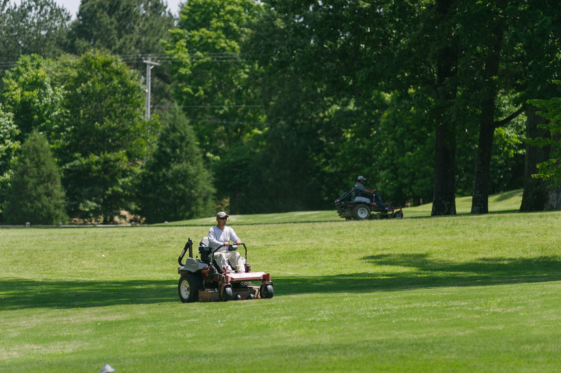 landscape technicians mowing commercial property