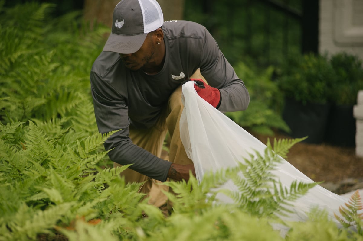 lawn care expert cleans up commercial property after winter