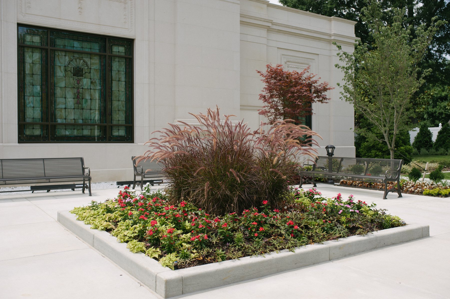 Plant bed with warm colors on commercial landscape