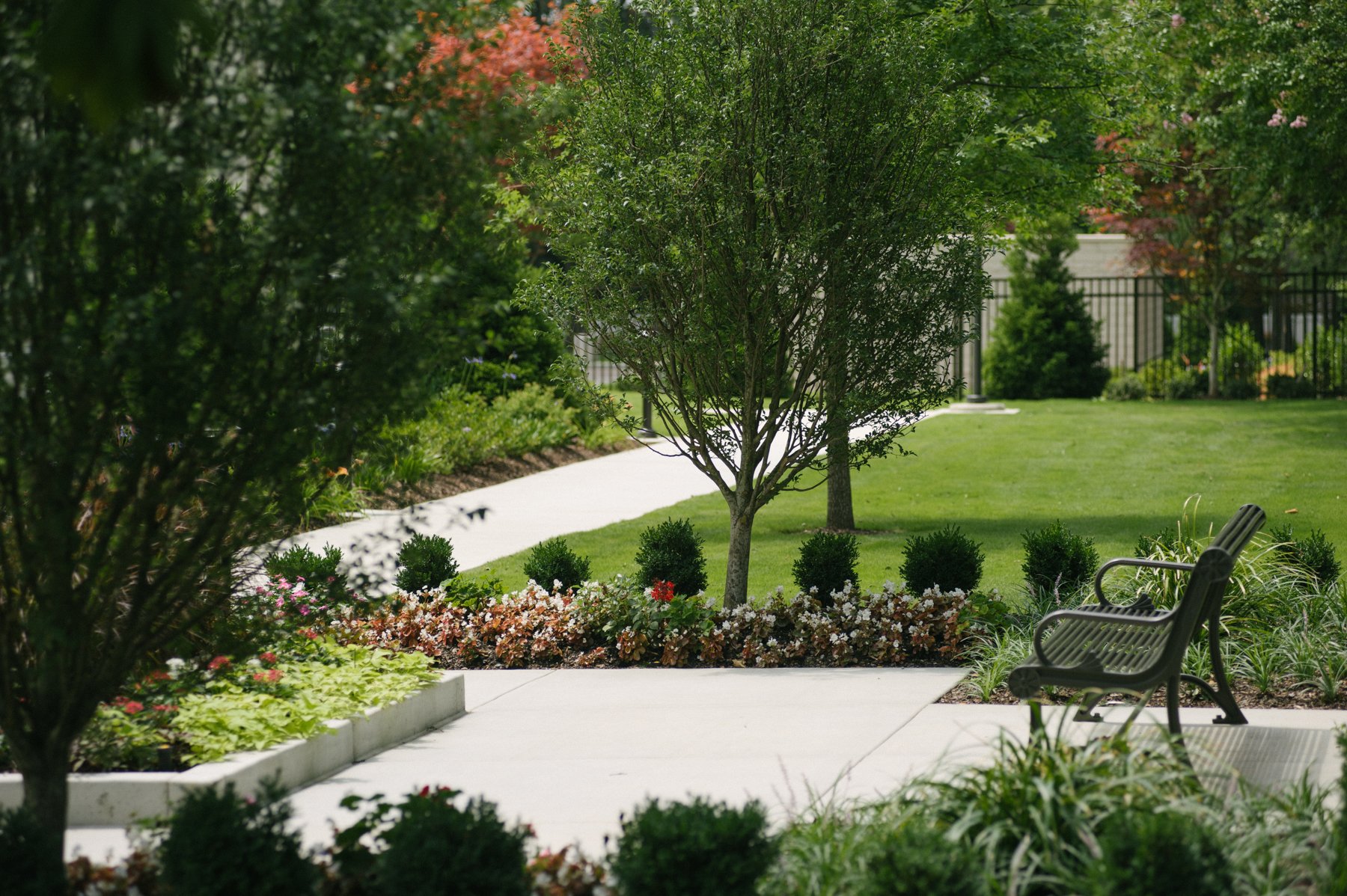 office building common area landscape with bench