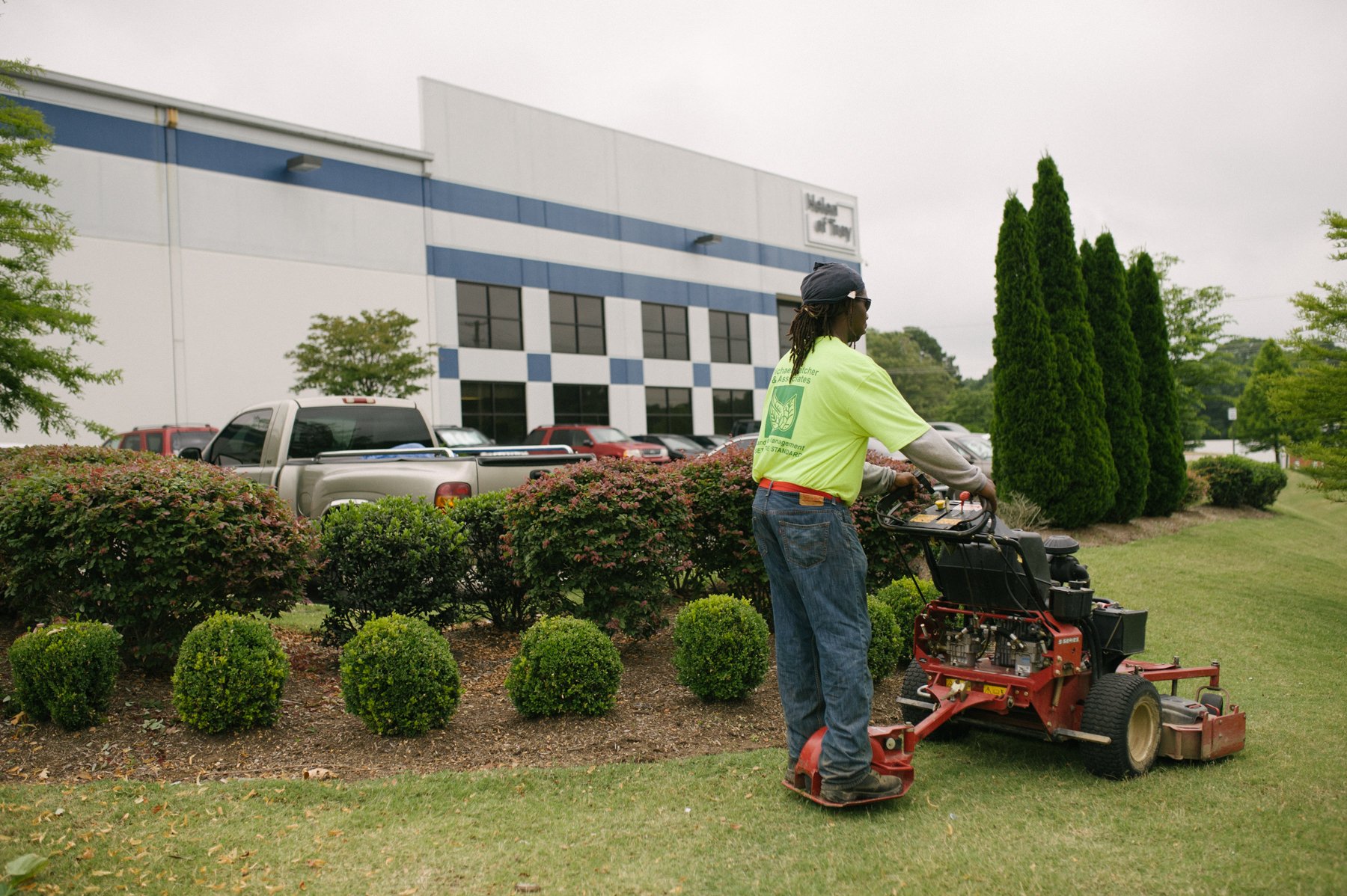 Commercial lawn care team mowing