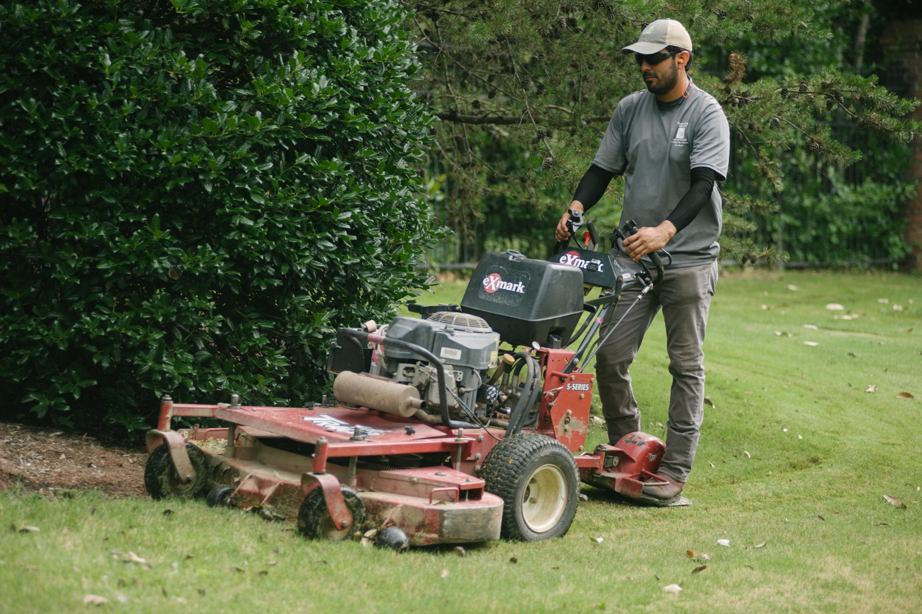 commercial lawn care team mowing