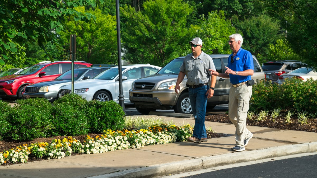 client and technician walk property