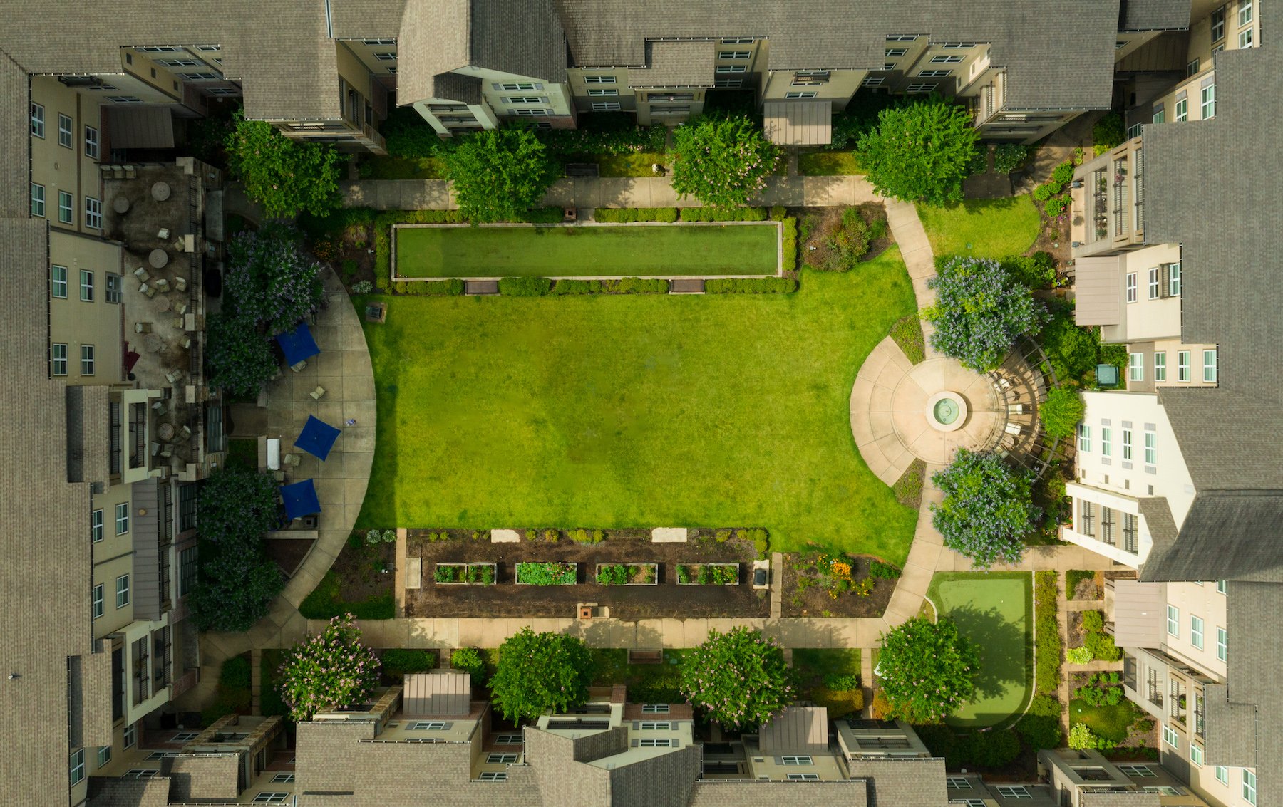 Dogwood Creek Retirement Community Courtyard with raised garden beds and water feature