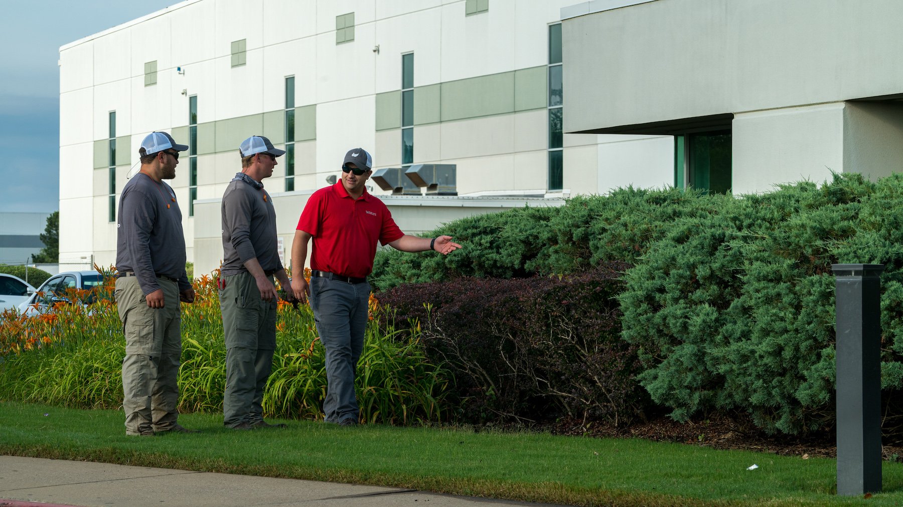 Landscape account manager explaining jobs to crew members