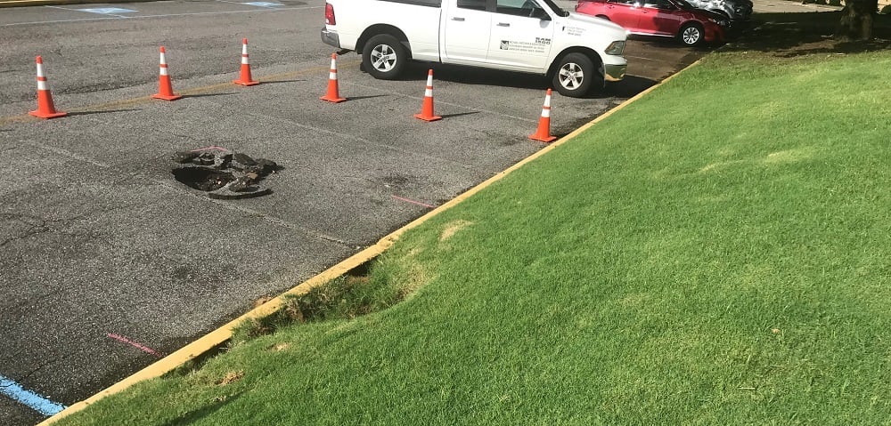 erosion damage in industrial parking lot